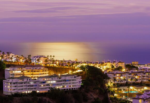 Night-time shot of the coastline in Marbella, Spain