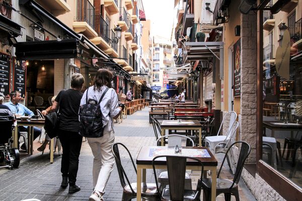 Benidorm, Alicante, Spain- October 9, 2021: Beautiful and narrow streets of Benidorm on a sunny day of Autumn